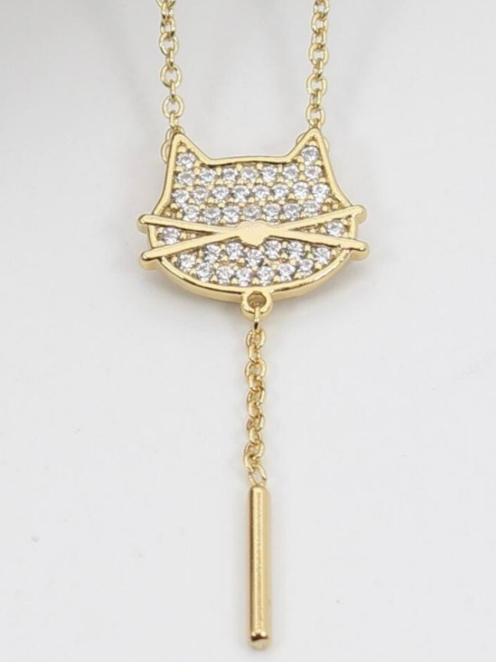 New Cat Face Cubic Zirconia Drop Lariat Necklace in Gold. Brand new in Box